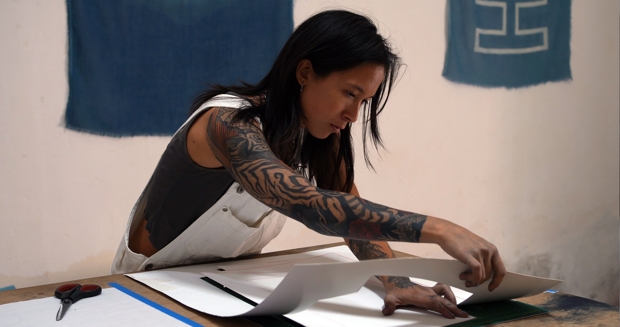 A young woman preparing materials for a natural dye